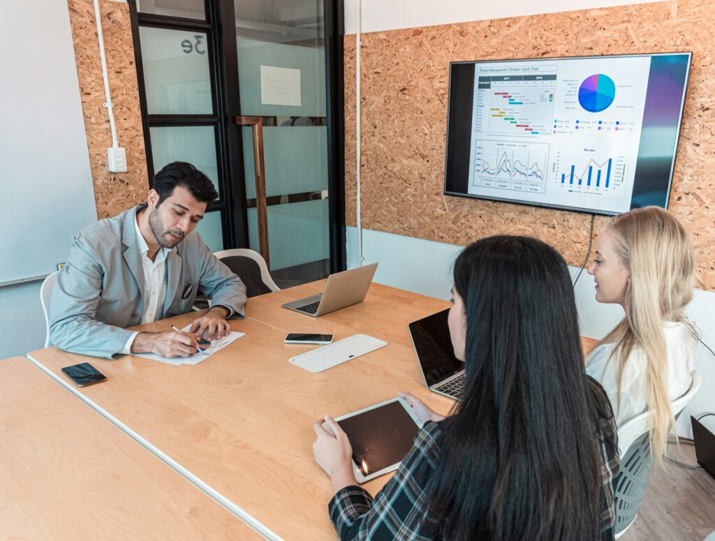 Boss brainstorming or discuss plan marketing with team business woman in modern office