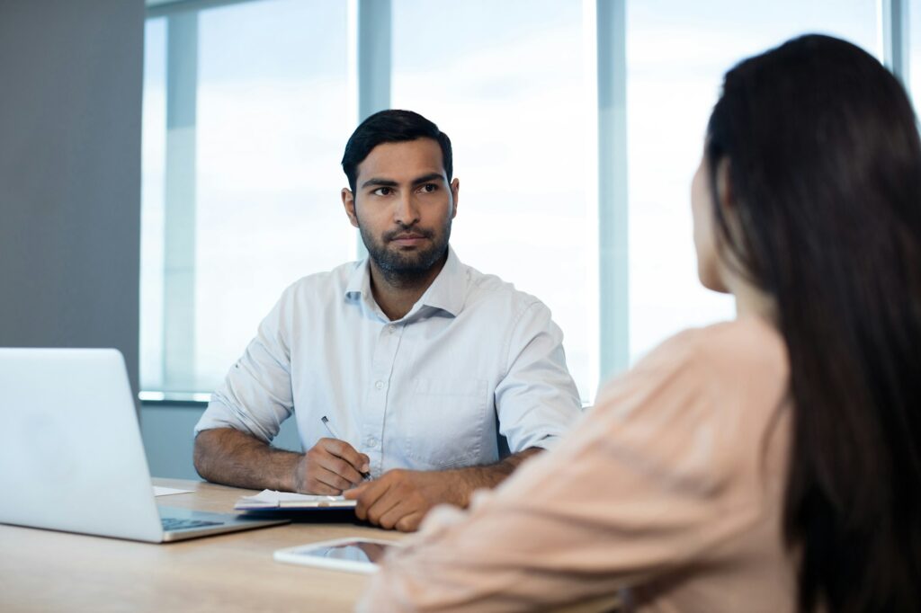 Business people discussing over contract